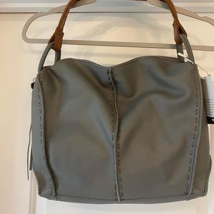 BRAND NEW- the Sak leather purse, gray with brown strap  paid $190 asking $75
